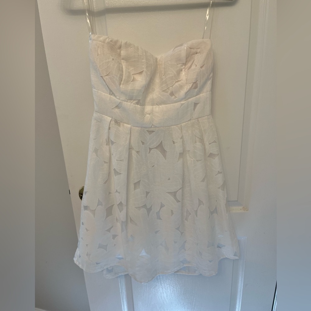 White, strapless, mini dress with flower print. From Charlotte Russe.